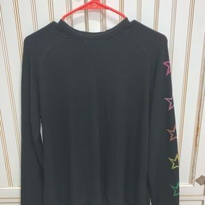 Black long sleeves shirt. Stars on sleeve.